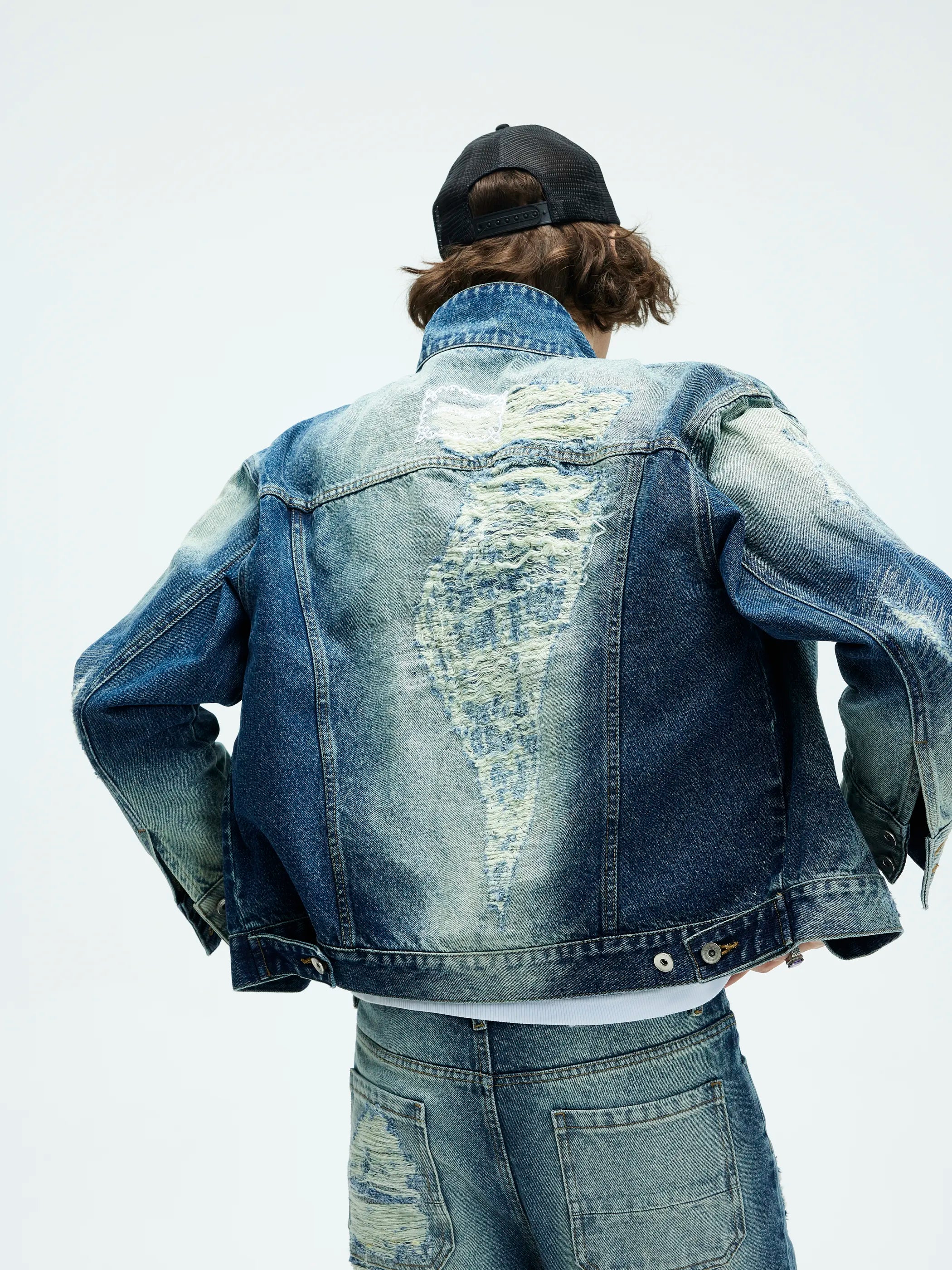 Model shot of Distressed Washed Denim Jacket 4