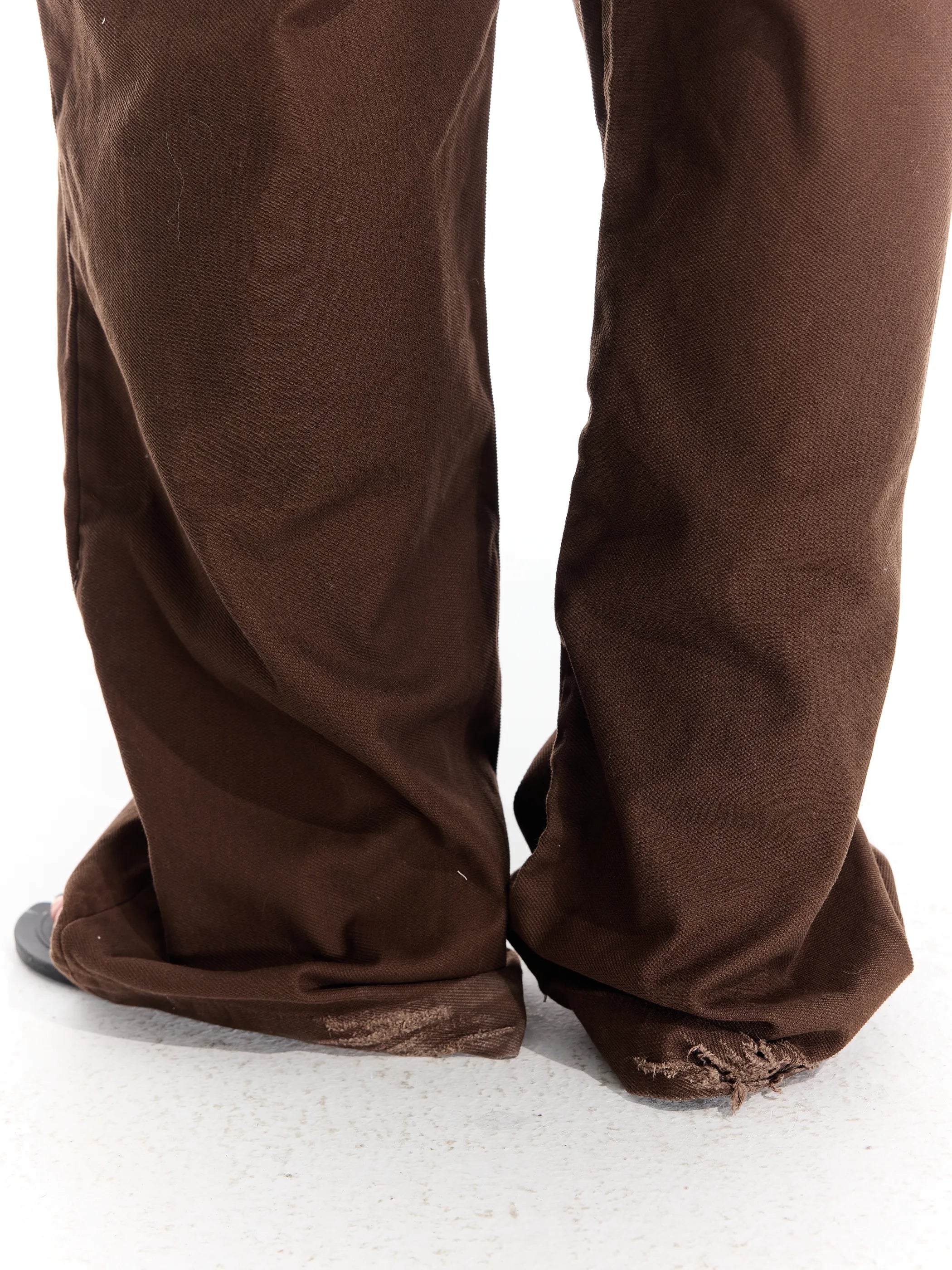 Riveted distressed straight-leg trousers